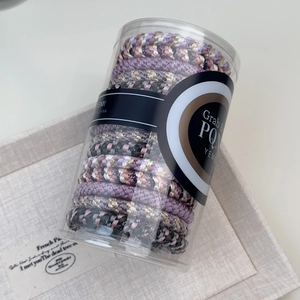 Jar of high-elasticity braided hair ties in pink, purple, and gray colors
