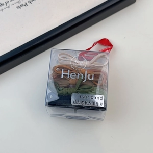 Detailed view of high elasticity bow hair ties set in a premium gift box packaging