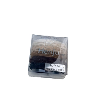 Durable elastic bow hair ties set in earth tones, packaged in a transparent box