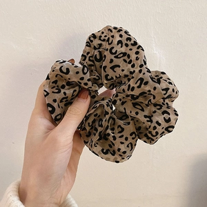 Large leopard print mesh scrunchie in brown tulle fabric for elegant hairstyles