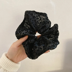 Large leopard print mesh scrunchie for women made of elegant black sheer fabric