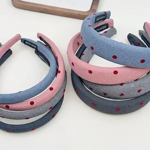 Polka dot fabric headbands in assorted colors with handmade inner label detail