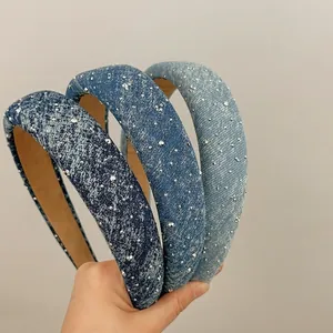 Three denim headbands with sparkling rhinestones in dark, medium, and light blue washes