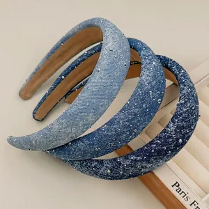 Three-piece set of padded denim headbands with sparkling silver rhinestones in blue tones