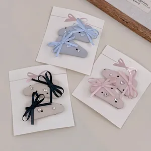 Set of 3 pairs of French lace bow hair clips with rhinestones in blue, white and pink