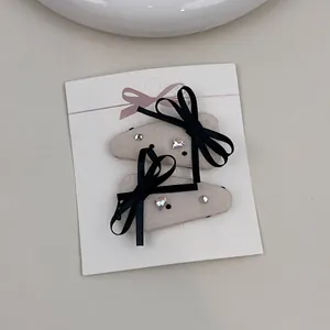 Lace bow hair clips with heart rhinestones and beige fabric wrapping for girls