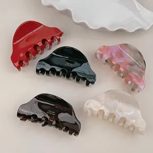 French vintage acetate hair claws in red, green, and marble textures for elegant styling