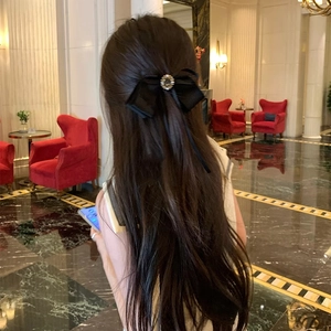 Elegant black velvet bow hair clip with a sparkling central rhinestone for women's hairstyles