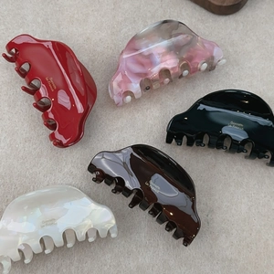 French vintage style acetate hair claws in five colors including red and pink marble