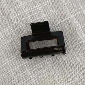 Detail showing high-quality acetate hair claw clip with gold FRANCE Handmade lettering
