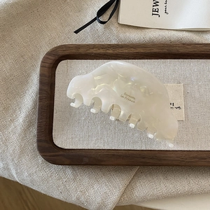 French vintage pearl white acetate hair claw clip with golden logo for elegant styling