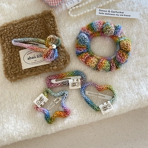 Handmade rainbow crochet hair clips set featuring heart, star, and bow designs