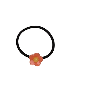 Sweet floral acetate hair tie with a pink flower and yellow button center for women