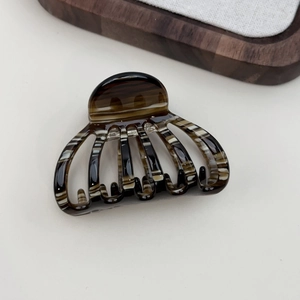 French chic acetate hair claw with brown tortoise pumpkin design and white stripes
