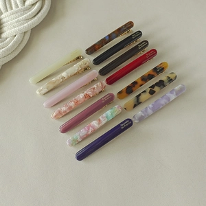 Set of minimalist acetate hair clips in assorted marble and tortoiseshell patterns