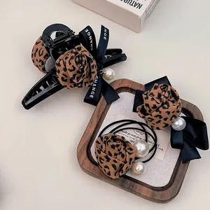 Leopard print hair claw and scrunchie set with black ribbon and elegant pearls