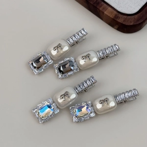 Elegant bow zircon hair clips with pearls and crystals in a set of four accessories