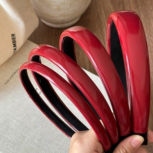 Set of five elegant wine red glossy leather headbands in various widths for women