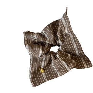 Retro brown striped scrunchie with a vintage square pattern and gold heart charm pendant