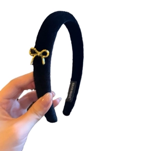 Elegant French vintage black velvet headband with a golden metal bow and handmade label