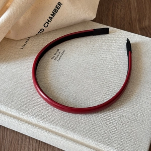 Premium burgundy leather headband with thin frame and soft black protective tips