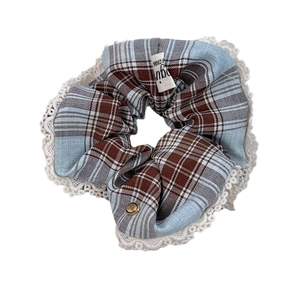 Blue and brown plaid scrunchie with white lace trim and vintage metal love button decor