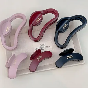 Set of 6 matte hair claws in pink, burgundy, and black with elegant gold lettering