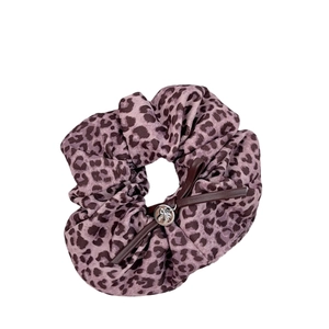 Pink leopard print fabric hair scrunchie with leather bow and silver metal charm pendant