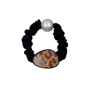 Elegant black scrunchie with round leopard print buckle and faux pearl accessory