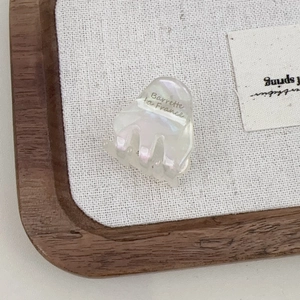 Elegant pearlescent white acetate hair claw clip with Barrette la France logo lettering