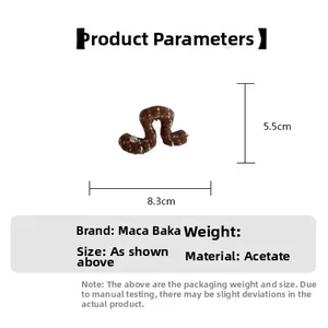 Detail view of acetic acid hair claw clip with size dimensions measuring 8.3cm by 5.5cm