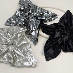 Three-pack metallic oversized bow scrunchies in silver, dark grey, and black satin