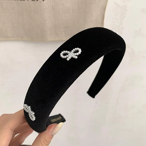 Elegant black velvet headband with pearl bow decoration for high crown hairstyle