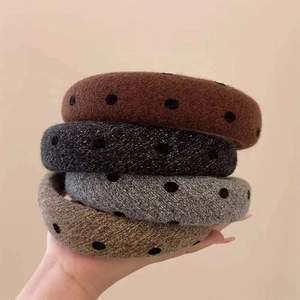 Set of four plush polka dot headbands in dark brown, black, grey, and light tan colors