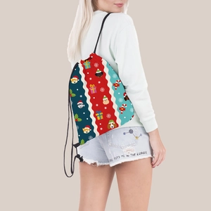 Christmas drawstring backpack with dog patterns shown on a model for travel and storage