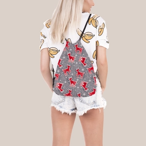 Rear view of Christmas reindeer drawstring bag worn as a travel backpack over a t-shirt