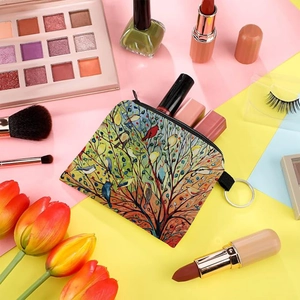 Artistic bird print small coin purse with keychain ring on a colorful aesthetic background