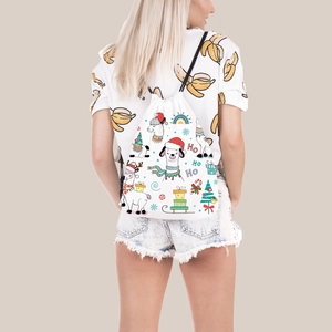 Christmas alpaca drawstring backpack with holiday gift patterns shown on female model