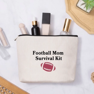 Linen-style makeup bag with Football Mom Survival Kit print and rugby ball pattern