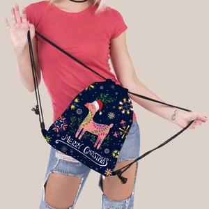 Detail of Christmas reindeer print on blue drawstring backpack with Merry Christmas text