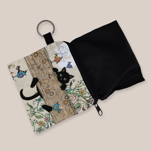 Portable coin purse featuring a cute black cat and bird illustration with a key ring