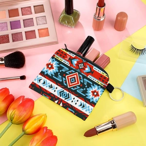 Flat lay of an Aztec print coin purse with cosmetics and vibrant geometric background
