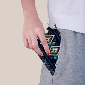 Aztec print coin purse with navy blue geometric patterns and silver keychain hook