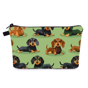 Detail view of the green dachshund print makeup bag with black zipper and woven loop