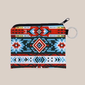 Detail of vibrant Aztec geometric print on canvas coin purse with durable metal zipper