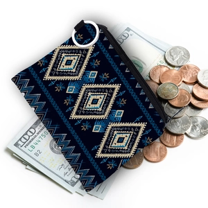 Aztec print coin purse with navy blue geometric pattern and metallic key ring detail