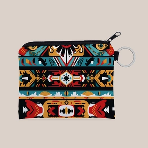 Detailed close-up of Aztec print coin purse with geometric patterns and metal keychain