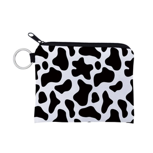 Compact black and white cow print coin purse with a metal keychain ring for women