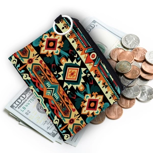 Aztec print coin purse with keychain showing capacity for bills and coins