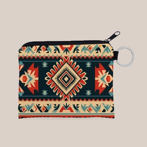 Detailed macro view of Aztec geometric patterned coin purse with silver key ring and zipper